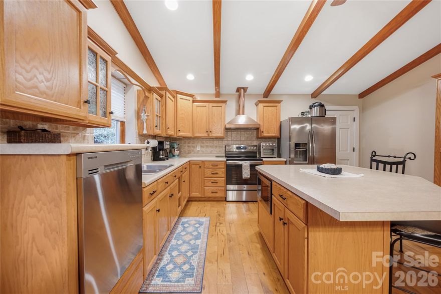 Beautifully maintained 3-bedroom, 2-bath home with additional flex space located in the desirable Sherrills Ford area. Situated on just under an acre, this property offers a private setting with convenient access to shopping, dining, and Lake Norman amenities.

The home features custom solid oak cabinetry, stainless steel appliances, Andersen windows, and a cozy wood-burning fireplace in the main living area. The versatile flex space is ideal for a home office, gym, playroom, or additional living area.

A standout feature is the impressive 24’ x 40’ attached garage accessed through the breezeway. The space includes a 12’ x 10’ storage room, totaling over 950 square feet, and is fully insulated with its own electrical service and a 30-amp RV hookup—perfect for hobbyists, workshop space, or additional storage. The large lot also provides ample parking space for a boat, RV, or other recreational vehicles.

Enjoy the low-maintenance Trex front porch and spacious backyard with room for outdoor activities, gardening, or entertaining.