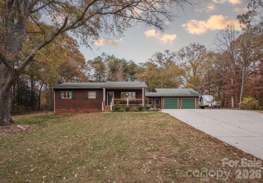 Beautifully maintained 3-bedroom, 2-bath home with additional flex space located in the desirable Sherrills Ford area. Situated on just under an acre, this property offers a private setting with convenient access to shopping, dining, and Lake Norman amenities.

The home features custom solid oak cabinetry, stainless steel appliances, Andersen windows, and a cozy wood-burning fireplace in the main living area. The versatile flex space is ideal for a home office, gym, playroom, or additional living area.

A standout feature is the impressive 24’ x 40’ attached garage accessed through the breezeway. The space includes a 12’ x 10’ storage room, totaling over 950 square feet, and is fully insulated with its own electrical service and a 30-amp RV hookup—perfect for hobbyists, workshop space, or additional storage. The large lot also provides ample parking space for a boat, RV, or other recreational vehicles.

Enjoy the low-maintenance Trex front porch and spacious backyard with room for outdoor activities, gardening, or entertaining.