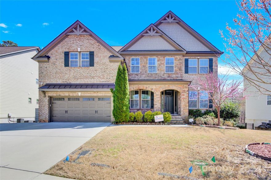 This Waterford features a main level guest suite with full bath. It also features an open gourmet kitchen, breakfast and great room; dining room with tray ceiling, a study and a sunroom. The second level features the owner's retreat with sitting room, owner's bath and large walk-in closet. Three additional bedrooms, two secondary baths, a game room and laundry room complete the second level. This home also has a basement with a guest suite, a bonus room and a media room. Backyard is fenced with wooded lot and lots of privacy. The entire house electric grid is powered by the Solar panels on the roof and whole house water filter system treats all the water used in the home for drinking, bathing, and even laundry.