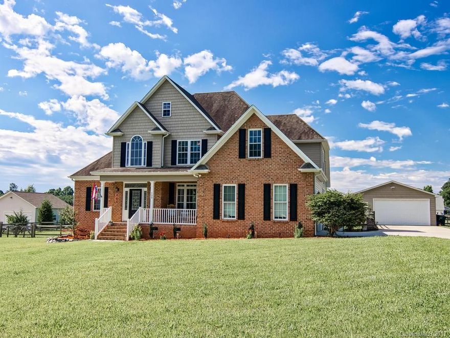 Lovely 4 bd 3 ba home in country setting, conveniently located close to Hwy. 115 and Hwy. 150, on over an acre.  2 car attached garage and 2 car detached garage. Great for car enthusiasts, those in need of workshop, or extra storage space! Large fenced in yard and large deck, perfect for entertaining! Inside contains multiple upgrades including hardwoods, granite counter tops, custom maple cabinetry, stainless steel appliances, and sealed crawl space for maximum energy efficiency.  NO HOA.