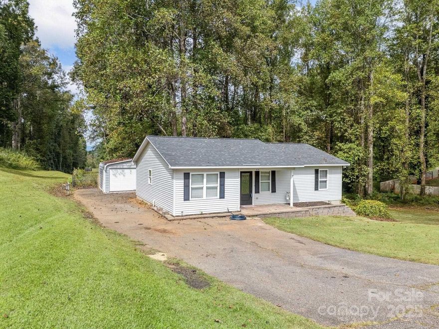 Updated home with 2 bedrooms, 2 baths situated on 1.14 acres with 2-car detached garage.