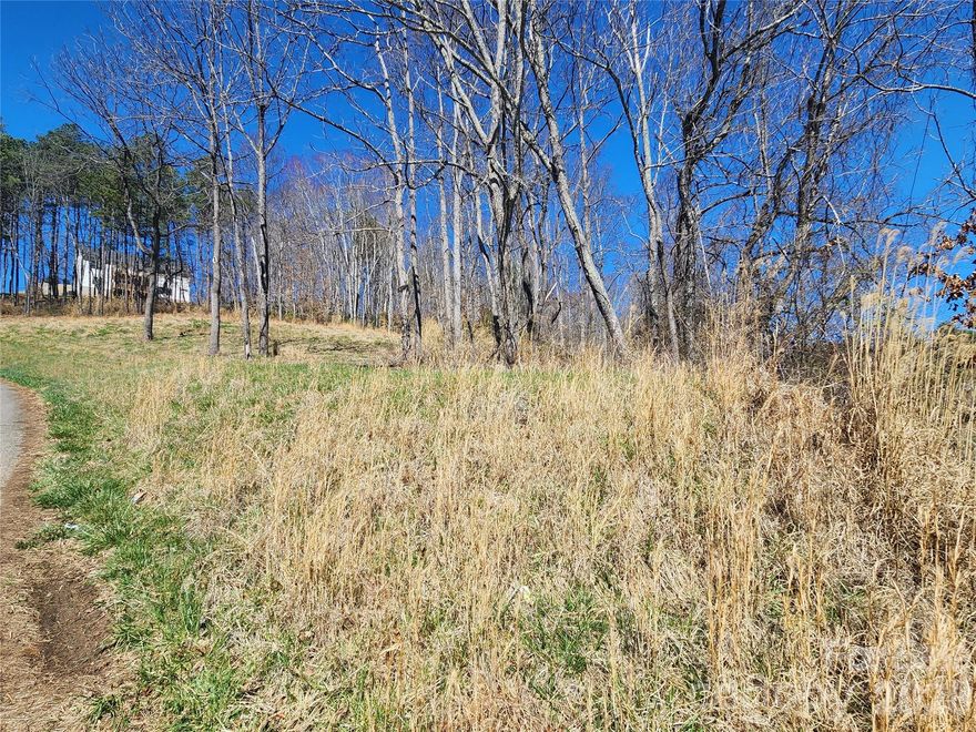 Come Build your dream home on this beautiful 1.52 acre lot. This lot offers ready access to electric utilities. This beautiful homesite combines convenience, and natural beauty to create the ideal setting for your custom dream home. Country Drive is conveniently located within minutes to Mars Hill, the home of Mars Hill University and approx. 25 minutes to vibrant Asheville.