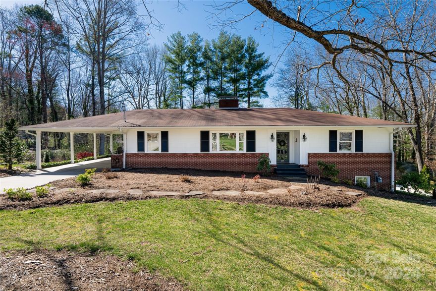 Exuding a sense of history, character & craftsmanship, this classic home is nestled on a generous .44-acre lot w/in the established community of Haw Creek. Ample windows provide copious natural light highlighting the beautiful hardwood flooring throughout the main level. Offering distinctive living, the main level showcases formal living/dining accompanied by an open kitchen & additional living area, along w/ a primary bedroom & ensuite, guest bedroom & guest full bath. The lower level is fully finished & includes laundry room, bonus room alongside a fully finished, permitted Homestay apt w/ 1.5-baths, separate driveway, parking & entrance. Well-manicured lawn, mature trees & flower beds promote traditional curb appeal.