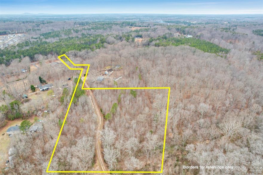 5 acres of unrestricted land in Troutman! Conveniently located between Troutman and Mooresville, this land is just waiting for its new owner. Property is wooded and private with a shared gravel drive and borders a creek. Land would work well as a private estate or even a mini farm. No restrictions on what type of home is built or timeline of when the home is to be built. If your'e looking for a more rural setting but close to everything then this may be the right fit for you!