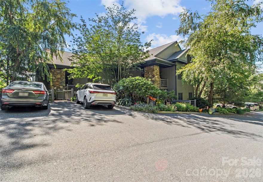 Fabulous Mountain Retreat with Panoramic Views at MOUNTAIN AIR. Experience breathtaking long-range mountain and valley views from this beautiful 3-bedroom, 3-bath Hemlock Buff Villa. This highly desirable home offers an additional room downstairs, in addition to the third bedroom suite, access to the view from the lower-level deck, and tall ceilings for a more "open" feel. Enjoy stunning sunset vistas and the ultimate in maintenance-free mountain living. Step into a spacious, light-filled kitchen featuring custom cherry cabinetry, a center island with flame cooktop, and a cozy breakfast nook with built-in banquette seating. The open-concept design flows effortlessly into the dining area and great room, where a stone fireplace and custom built-ins create a warm, inviting space for gathering. Enjoy year-round outdoor living on the screened side porch, complete with a second stone fireplace—perfect for cool mountain evenings. The primary suite boasts sweeping mountain views, a luxurious en-suite bath with whirlpool soaking tub, separate shower, and double vanity. The lower level offers another private guest suite mirroring the primary, along with a flexible den/office or bonus sleeping space. Convenient golf cart parking and storage are just steps from the front door. Nestled between two parks—Hemlock Park, with its babbling creek and picnic area, and Springrock Park, featuring a firepit and outdoor lounge space—you’ll enjoy peaceful surroundings and unforgettable sunsets. This villa is the perfect mountain escape—elegant, turnkey, and effortlessly livable.