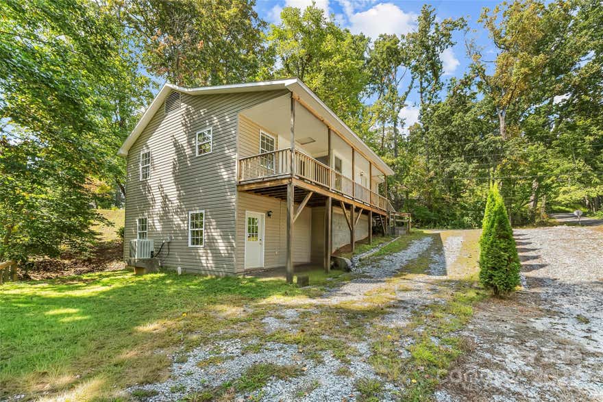 Welcome to the desirable Royal Pines neighborhood in sought-after South Asheville! This thoughtfully designed home offers 2 bedrooms and 1 bathroom with convenient access to shopping, dining, and all that Downtown Asheville and Downtown Hendersonville have to offer, including an array of restaurants and breweries. Built with future expansion in mind, the home was built with the possibility of converting it into a 3-bedroom, 2.5-bath residence, providing vision for the next owner. The expansive daylight basement, with both a partially finished area and a private outside entrance, offers endless possibilities, whether you envision extra living space, a home office, or additional square footage tailored to your needs. Having served as a successful long-term rental since 2004, this property also presents an excellent investment opportunity with continued income potential. Whether you’re a first-time buyer, downsizer, or investor, this home offers convenience, flexibility, and room to grow.