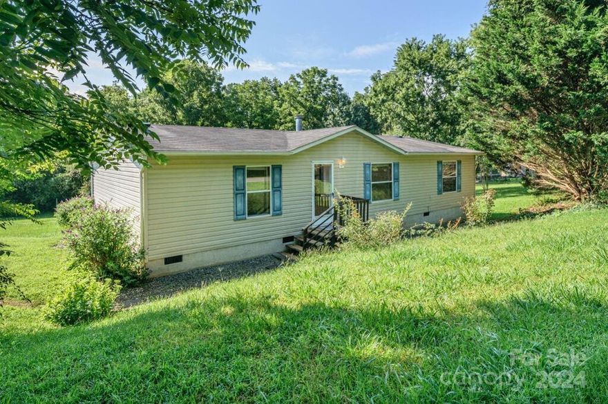 3 Bedroom, 2 Bathroom home ready for you to move right in.  Located in a very walk-able and peaceful neighborhood.  Sited on .35 Acre. 
Head out back and soon you will be able to enjoy the Ecusta Trail. Property backs the Trail!  Level Yard, Rear Deck great for relaxing.  
Living room features Fireplace, currently with electric insert. 
New carpet throughout. Newer Refrigerator, New Dishwasher.  Convenient to either Hendersonville or Brevard.  Etowah Valley Golf & Resort is a premier mountain golf resort, featuring a championship 27-hole golf course, indoor and outdoor dining and is 3 minutes away. 
Don't Miss out!