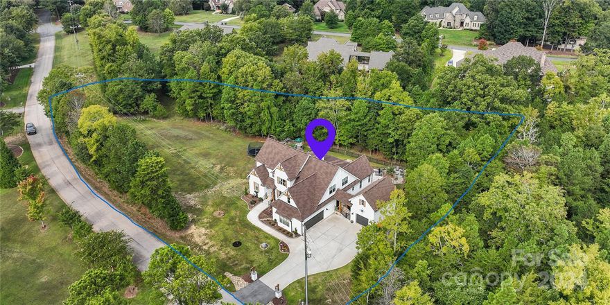 Now is your chance to own this breathtaking 4,150 square ft. custom-built home. Nestled on a sprawling 1.16-acre lot with no HOA, this 4 bedroom, 4.5 bath home boasts an open-concept floor plan with an abundance of natural light, rich hardwood floors throughout, a chef’s kitchen featuring premium stainless steel appliances & custom cabinetry, two laundry areas, an entertainment room with a wet bar, and a movie theater. An attached two car garage is accompanied by an additional detached garage with a large bonus room upstairs. Step outside your private oasis to an expansive fenced in backyard with a screened-in porch, an in-ground pool and fire-pit. This spacious, modern and well-designed home truly presents an exceptional opportunity for someone seeking luxury and functionality.