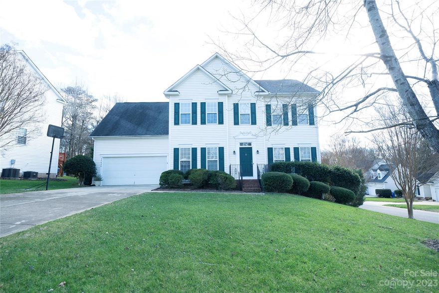 Step into this beautiful home nestled in the serene embrace of Cardinal Woods! This meticulously maintained 4-bed, 2.5-bath haven is positioned on a corner lot, just minutes away from the bustling scenes of Ballantyne and Pineville. The home welcomes you with beautiful hardwood floors, a dedicated office, formal dining, and a charming fireplace in the great room. Boasting new stainless-steel appliances, the heart of this residence is as stylish as it is functional. Upstairs features 4 nice-sized bedrooms with a laundry room for convenience. The primary suite indulges with an oversized closet for added convenience.  Contemporary touches, including fresh paint, new carpet, and chic vinyl plank flooring in the bathrooms, elevate the ambiance. Step outside to a freshly painted screened porch and new screening, and deck—an idyllic retreat for outdoor enjoyment, new cooling unit 2023, New garage motor 2023.  Zoned for the new Ballantyne Ridge High School in 2024-2025 per Polaris website.