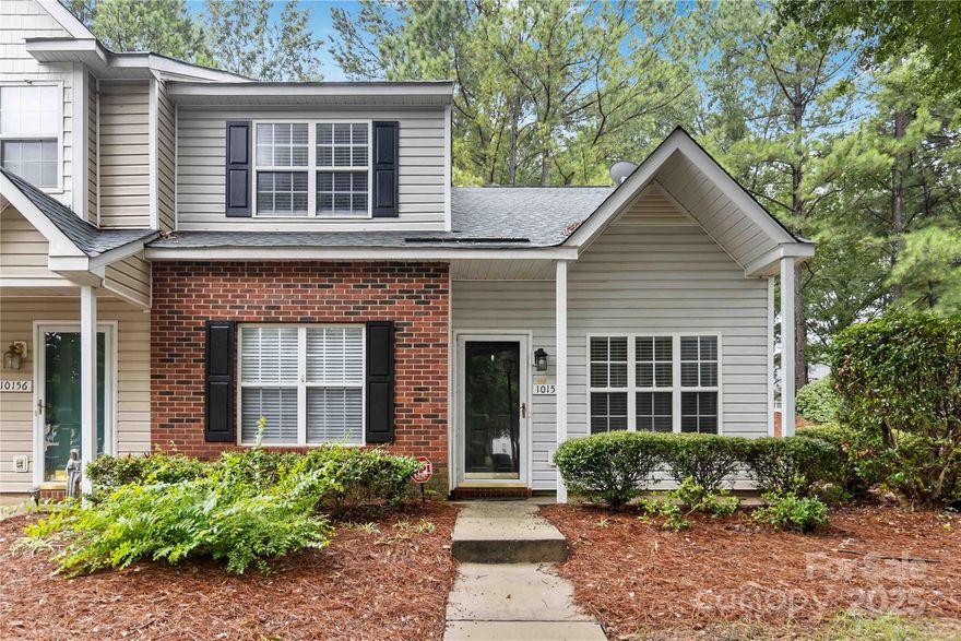 Schedule your appointment for this beautiful move-in ready End-Unit townhome just minutes from UNCC—ideal for first-time buyers, students, or investors. A covered front porch welcomes you into a bright and open living room with vaulted ceiling. The main-floor primary suite includes a gorgeous updated ensuite bath. The kitchen features ample cabinetry with a peninsula, pantry, and direct access to the dining area and outdoors. The open staircase takes you upstairs to two bedrooms and full bath.  The third bedroom has direct access to a full bath and can be used as a game room/office with the loft-style room that overlooks the living space below.  Interior has been freshly painted and has new LVP flooring on the main level. Generous storage throughout, including a large under-stair closet and outdoor storage unit. Enjoy a private back patio and community amenities including pool, clubhouse, playground, and sidewalks. Convenient to I-485, shopping, dining, and campus events.