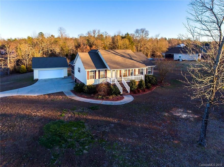 Country living w/ easy city access! Very well-maintained, one owner home. Situated on one acre w/ oversized, finished garage, rear screen porch, rocking chair front porch & storage building! Move in & enjoy this delightful home w/ spacious kitchen, vaulted great room & all bedrooms w/ walk in closets. New HVAC system; recent roof and appliances. Smooth ceilings. Garage is insulated & finished w/pull down attic. Community with no HOA! Be the first to see this cutie!