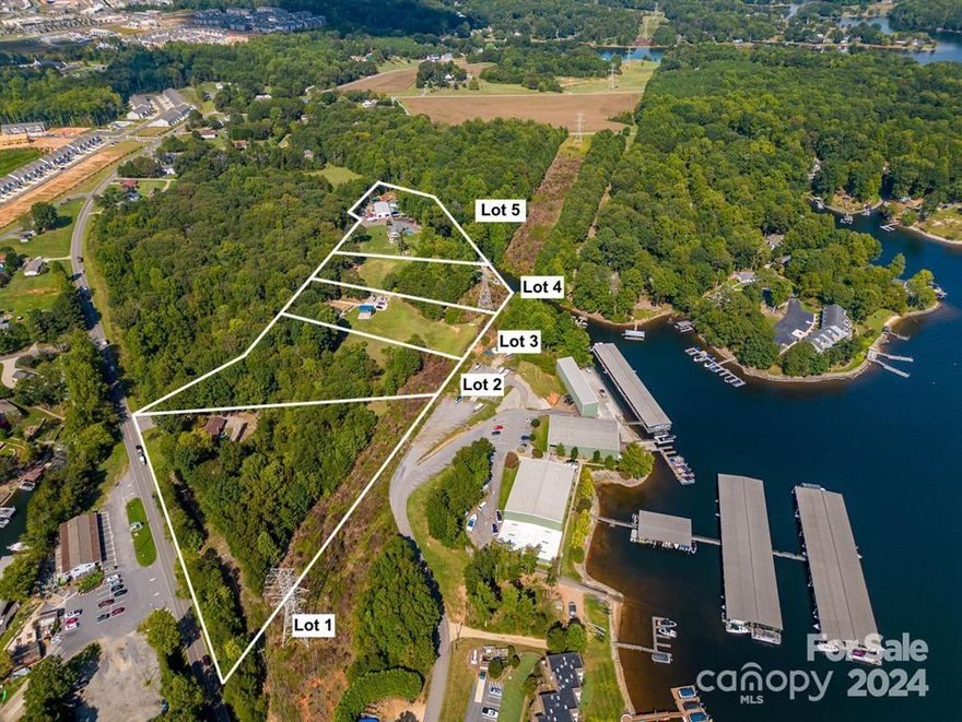 Possible development for Condos and townhomes on Lake Norman with lake access and dock access on ENOCH. 3-mile views of Lake Norman. Do not drive on property without an appointment. Marina next door. Publix shopping center within 5 minutes of property. Close proximately to shopping and restaurants.
 
Possible development for Condos and townhomes on Lake Norman with lake access and dock access on ENOCH. 3-mile views of Lake Norman. Do not drive on property without an appointment. Marina next door. Publix shopping center within 5 minutes of property. Close proximately to shopping and restaurants. This property consists of 4 separate parcels being sold together. One has lake access, but no dock can be built. Duke Energy said that if the potential buyer developer applied for the proper permits that you can possibly get class B rip rap which is a flat rock and have walkable assess for paddleboarding etc. on parcel 4. The 4 Parcels also have lake access, and a dock across the road that is for these 4 separate parcels on Enoch Road.