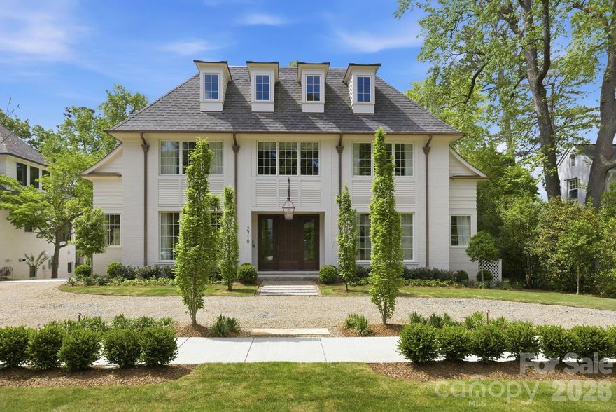 Stunning Myers Park home by Aaron Cote Architecture and Thompson Building Group, beautifully blending timeless design with modern touches. Exceptional interior finishes make this home truly one of a kind. The welcoming entry and formal dining room lead into an open-concept layout featuring a spacious family room with fireplace and custom built-ins, a bright breakfast area, and a chef’s kitchen with a large marble island and butler’s pantry—perfect for everyday living and entertaining. The main level also offers a functional drop zone with pantry storage, an office nook, and an incredible primary suite designed for comfort and convenience. Upstairs, generously sized bedrooms with hardwood floors and en-suite baths provide privacy, while multiple flex spaces offer endless options for entertaining, working, or exercising. The covered porch with fireplace, detached 2-car garage & beautifully landscaped backyard offer a private oasis. Don't miss the fully encapsulated crawl space & incredible attic storage for added comfort & functionality. This home truly has it all!