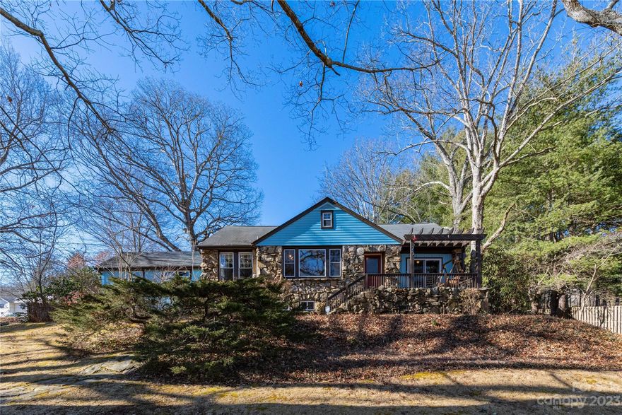 Old world charm exudes from this 3BR, 3BA stone house near the Kenilworth neighborhood; close-in living with privacy on this oversized lot and easy access to amenities, only 4 minutes to downtown Asheville. Relax on the back patio or enjoy views of Sunset Mountain from the front porch. Features split bedroom single level living with modern updates and a newer Primary suite addition with stone accents; local woods, walk-in closet w/ built-ins & a stone accented shower.  Large backyard features vintage 2 car garage, garden shed/coop, plenty of room for gardening and RV parking.  Quintessential Asheville living.