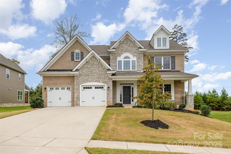Stunning Brick & Stone Beauty in Gated Bretagne!
This gorgeous home makes a statement from the moment you arrive with its beautiful brick and stone exterior, Hardiplank siding, spacious front porch, and impeccable curb appeal. Tucked on a private homesite with a wooded backdrop, it offers both charm and serenity.
Step inside to a “wow” first impression, the soaring foyer opens to elegant metal railings, a catwalk, and a loft above, creating an airy and inviting feel. The spacious dining room features rich moldings and a stylish bump out, while luxury vinyl plank flooring flows seamlessly throughout the main level.
The gourmet kitchen is a showstopper with upgraded white cabinetry, a large center island, quartz countertops, stainless steel appliances, gas cooktop, wall oven, microwave, and a walk-in pantry thats perfect for both everyday living and entertaining. The open family room is anchored by a cozy gas fireplace and large windows that fill the space with natural light. A guest suite with a full bath, drop zone, and concrete patio complete the main level.
Upstairs, a spacious loft offers great flexibility for work or play. The primary suite is a true retreat with a tray ceiling, spa-like bath featuring tile flooring, a huge tiled shower, double vanities with quartz countertops, and updated light fixtures. Two additional bedrooms and a stylish hall bath provide plenty of space for everyone.
Located in the gated neighborhood of Bretagne, residents enjoy a community pool, playground, and sidewalk-lined streets. Close to Ballantyne Bowl, and all the wonderful shopping and restaurants in the area. Beautiful finishes, a thoughtful floor plan, and a private homesite make this home a must-see!