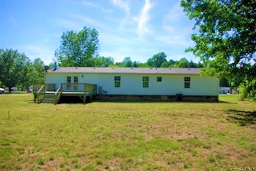 Completely Remodeled, Adorable Home! Close to Charlotte, but still in the country- She's the prettiest on the block, inside and out with a all new carpet, paint, stainless steel appliances and flooring as well as a large, tree-lined backyard and landscaped half-circle driveway. Updated and move in-ready, you won't find a home like it! She won't last long!