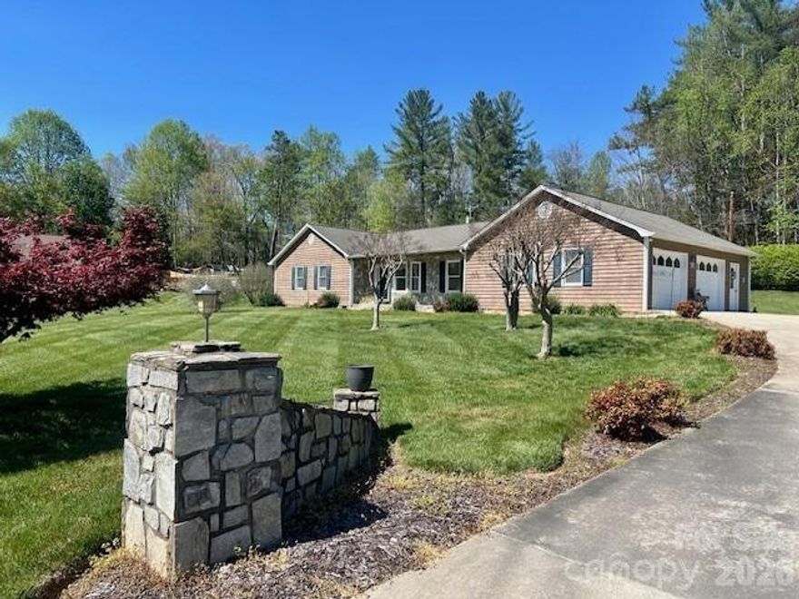 Gorgeous Country Setting with Space, Style & Convenience!

Welcome to this beautifully maintained 3-bedroom 2 full bath home nestled on 1.27 acres of scenic, landscaped grounds—the perfect blend of peaceful country living and everyday convenience. This property offers all the “bells and whistles” at an affordable price point!

Inside, you’ll find a warm and inviting layout featuring a spacious great room with vaulted ceilings, along with a living room/dining room combination ideal for entertaining. The kitchen is well-appointed with oak cabinetry and solid surface countertops, offering both functionality and charm.

Hardwood floors flow throughout the main living areas, while the bedrooms feature well-maintained carpet for added comfort. A gorgeous rock fireplace creates a stunning focal point in the great room, adding character and coziness. The home is heated and cooled by a heat pump system.

The oversized garage provides ample space for two vehicles and includes a large laundry room with sink and an additional storage room—perfect for hobbies or tool storage.

Step outside and enjoy the meticulously landscaped yard with plenty of room for a garden, outdoor living, or even a horse. A rock-accented driveway entrance adds to the home’s curb appeal and welcoming feel.

Ideally located, this home offers a short drive to both downtown Morganton and downtown Lenoir and is just minutes from the natural beauty of the Wilson Creek scenic river.

Note: Home is being sold as is. Seller is a relative of the listing agent.