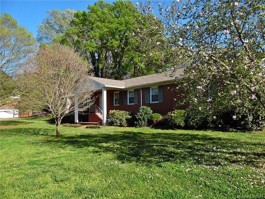 Large brick ranch on a beautiful corner lot with easy access to I-77, shopping, dining, and more. Traditional style home has expansive formal living/dining areas, inviting foyer, cozy den with brick fireplace, eat-in kitchen, laundry with lots of cabinet storage, and spacious bedrooms.  Fenced yard offers detached storage, fruit trees, and adjoining coy ponds.  A wonderful opportunity to add your personal touches and make this one yours!