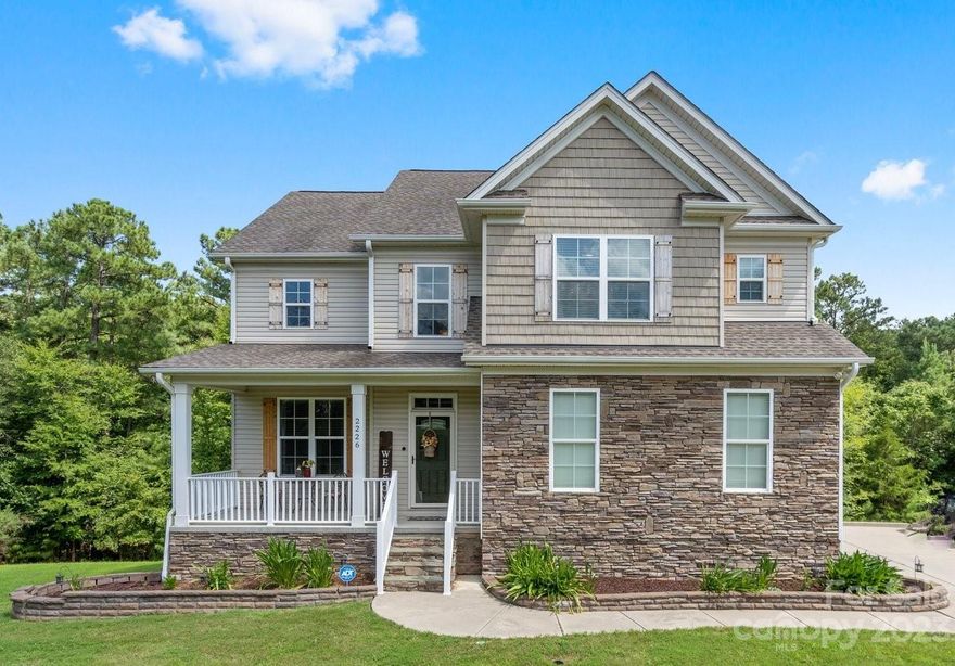 Discover the perfect blend of privacy and lakefront allure. A home designed for those who value tranquility and Southern charm. Tucked away in a community with no HOA, this 1.48-acre lot offers endless possibilities and enough privacy to enjoy it. This exceptional property boasts a rarity - a fully renovated basement, complete with a bedroom and full bathroom. Relish your independence with a marina just 2 miles away and access to highly rated schools, all within a 20 minute drive to the city of Charlotte. Inside, a grand two story foyer welcomes you, leading to an open concept living space with upgraded vinyl luxury plank flooring. A well equipped kitchen adorned with granite countertops, updated light fixtures, butlers pantrty, a substantial island, under cabinet lighting and a walk in pantry. Upstairs you will find four bedrooms including the primary, a full bathroom and laundry room. The spacious primary bedroom features his and her closets and en suite bathroom. A true must see!