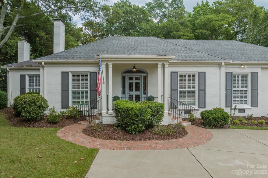 Beautifully renovated, brick ranch style home located in Myers Park. Open & flexible floor plan, welcoming foyer, light wood flooring, & abundant natural light. Inviting living room w/fireplace leads to a generously sized den w/custom built-ins & a 2nd fireplace. The kitchen & breakfast area are an entertainer's dream! Oversized quartzite island, white custom cabinetry, gas cooktop, double ovens, breakfast nook, & beverage fridge in bar area. Luxurious, oversized primary bedroom retreat w/vaulted ceilings. Elegant spa like bath hosting gorgeous floors, marble rain/steam shower, double vanities & stand alone tub. Sunroom opens to the private, back yard & terrace. Two additional bedroom ensuites are located on main plus a bedroom/bonus room with private bath on the upper level. 2022-duct work replacement, crawlspace encapsulation, AC unit (1/2), Furnace (1/2), mini split 2nd floor, carport, 2021-exterior paint, 2018-water heater, 2016-whole house water filtration system. Welcome Home!