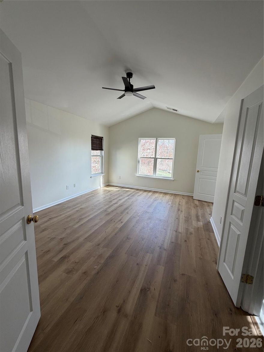 Welcome to this beautifully updated 3-bedroom, 2.5-bath home in Charlotte that combines modern upgrades with peaceful surroundings. Backing up to a wooded area, this property offers both privacy and convenience in a desirable location.
Inside, you’ll find new flooring throughout, including Pergo Timbercraft 100% waterproof luxury vinyl plank in the bedrooms and living areas and Stainmaster 100% waterproof tile-look flooring in the bathrooms and laundry room. The entire home has been freshly painted in a satin finish, making it both stylish and easy to maintain. The kitchen features new white quartz countertops with a 4" backsplash and a spacious 16" bar overhang, along with a new sink and all appliances conveying, making it truly move-in ready. New lighting throughout the home adds a bright, modern touch. Additional updates include a new bathtub in the upstairs secondary bathroom, new back storm door, and repaired siding + soffit for added peace of mind.
Step outside and enjoy the refreshed backyard with fresh mulch, new plants, and a new walkway, creating a welcoming outdoor space that overlooks a serene backyard. A 2-car garage, rare in this neighborhood, provides ample storage and parking.
With thoughtful updates inside and out and a calm natural backdrop, this Charlotte home is ready for its next owners to move in and enjoy.