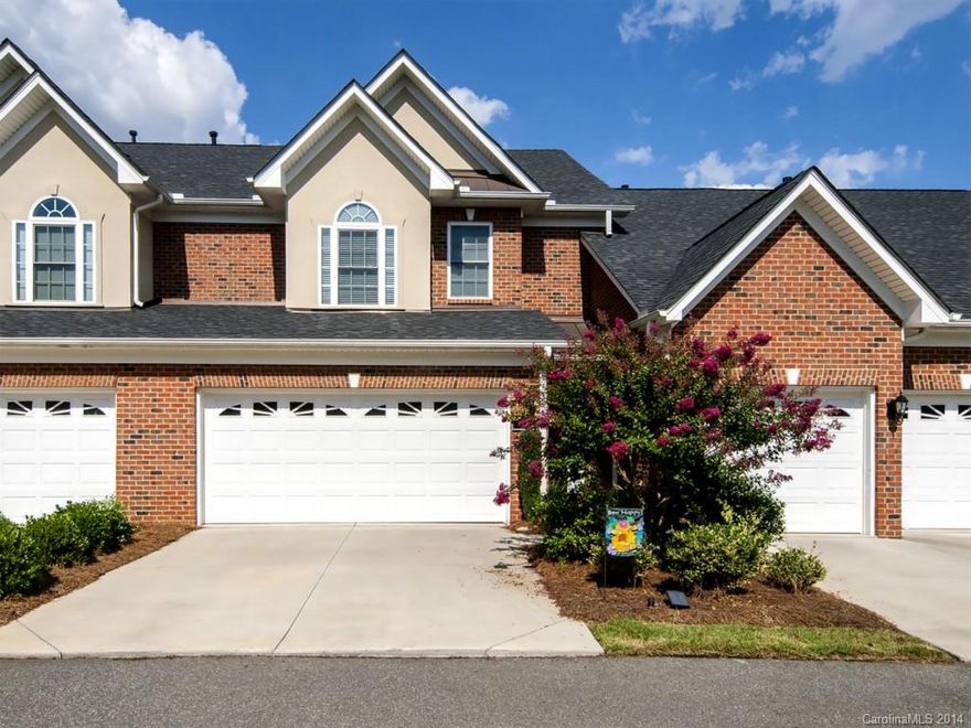 Stunning town home in a gated community.  Beautiful hardwoods and crown molding throughout the main level. Nice open layout with large furniture-style island in the kitchen. Tile back splash and granite counter tops in the kitchen. Great pantry closet under the stairs. Large Master Bedroom with tray ceiling. Master bath features separate jetted tub and tiled shower. Hugh walk-in closet in the Master BR. Updated lighting and fixtures throughout the home. Enjoy the 10-acre pond across the street.