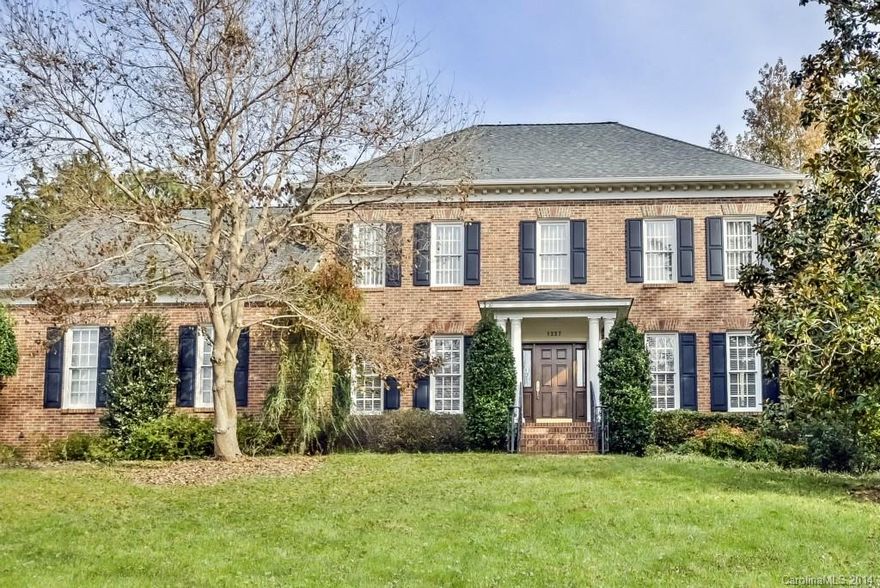 All brick traditional home in one of South Charlotte's finest neighborhoods. Recent updates include designer kitchen, SS appliances enhanced by granite counters. Master bath includes custom designed walk-in closet. Main level features 9' ceilings with gleaming hardwood flooring. Screened porch overlooks brick terrace and fenced in backyard. Location at it's best!!