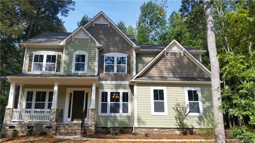 NEW semi-cust. 3500+ HSF, 4Br/3.5bth quiet wooded home site with charm of Mint Hill and convenience of 485. Loaded with custom options including, 10&9' ceilings, gour. kit. w/gas cooktop, lg island, granite, stainless steel, butler pantry, 5” hardwood floors main, & lux. mast. suite w/tray ceiling, dual gran. vanities, 5' shower & gard. tub. Expansive windows along back of home provide nat. light & serenity.  Other features: oversized bonus rm, priv. study, formal dining, side entry gar. & deck.