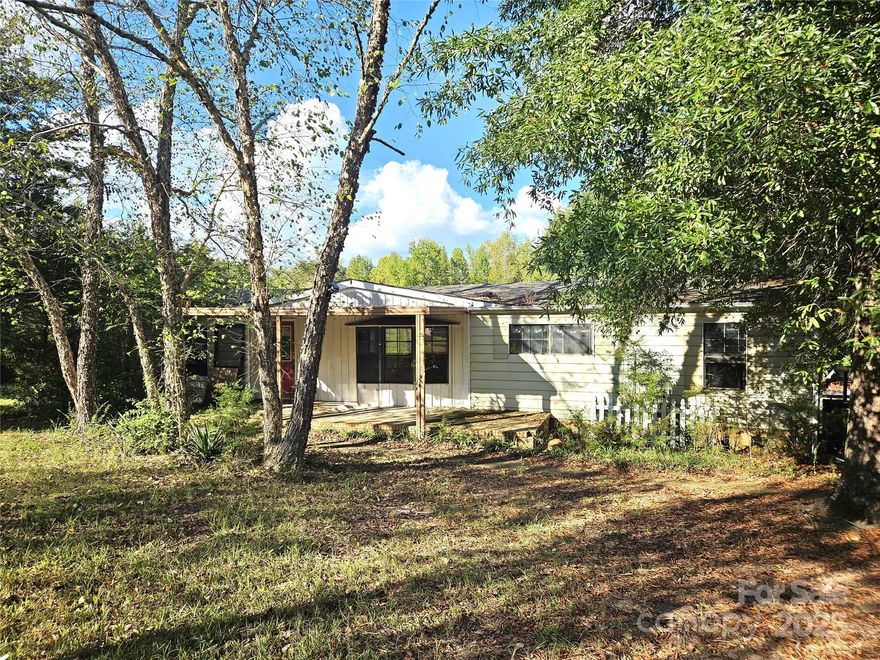 Endless possibilities are offered here on this 6.02-acre parcel, nestled in a highly desirable area with new homes and nearby beautiful horse farms, offering the perfect blend of privacy and potential. The property features an existing manufactured home with utilities in place that could be remodeled or removed—you choose your vision. The majority of property's value is the land so whether you're looking to build your dream private estate, family compound or you're a developer seeking land to subdivide, this is a rare find with incredible upside. Also included is a detached garage/workshop, ideal for the home hobbyist, a cozy man cave, or a stylish she shed. Don't miss your chance to own a slice of the countryside with city conveniences nearby. Bring your vision and make it your own!