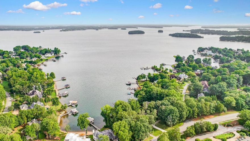 WATERFRONT on Lake Norman! An AMAZING opportunity awaits you! Are you looking to build your dream home? Now is the time to take advantage of this Prime Location with Stunning Main channel views of Lake Norman and NO HOA! Surrounded by mature trees, ample privacy and just under .50 acres, this is the perfect spot! This 3BR ranch home is more than likely a tear down so bring your builder and design away! Home has 4th BR on what looks to be a coverted sunroom.  No knowledge of permits involved. Come relax on your Private dock and enjoy all Lake Norman has to offer! Close to Restaurants, Shopping, Grocery Store, Interstate and much more! Book your appt today before this one gets away!