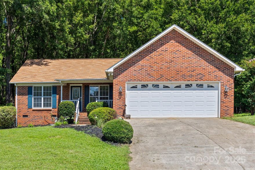 This beautifully maintained home is nestled on a large double lot in a quiet neighborhood. Just minutes away from historic downtown York, SC, this inviting residence offers a spacious living room which provides the ideal gathering place, while the kitchen features lots of cabinet storage, ample counter space, and a cozy dining area. The primary suite features a private retreat with a generous walk-in closet and en-suite bath. Additional bedrooms are well-sized, perfect for family, guests, or a home office. Enjoy outdoor living on the back patio overlooking a large, level yard—great for entertaining, gardening, or relaxing evenings. The 24’3” x 40’3” wired shop, and the attached two-car garage both add convenience and storage space. Located just a short drive from shopping, dining, and schools, this home combines small-town charm with easy access to Rock Hill, Lake Wylie, and Charlotte.
