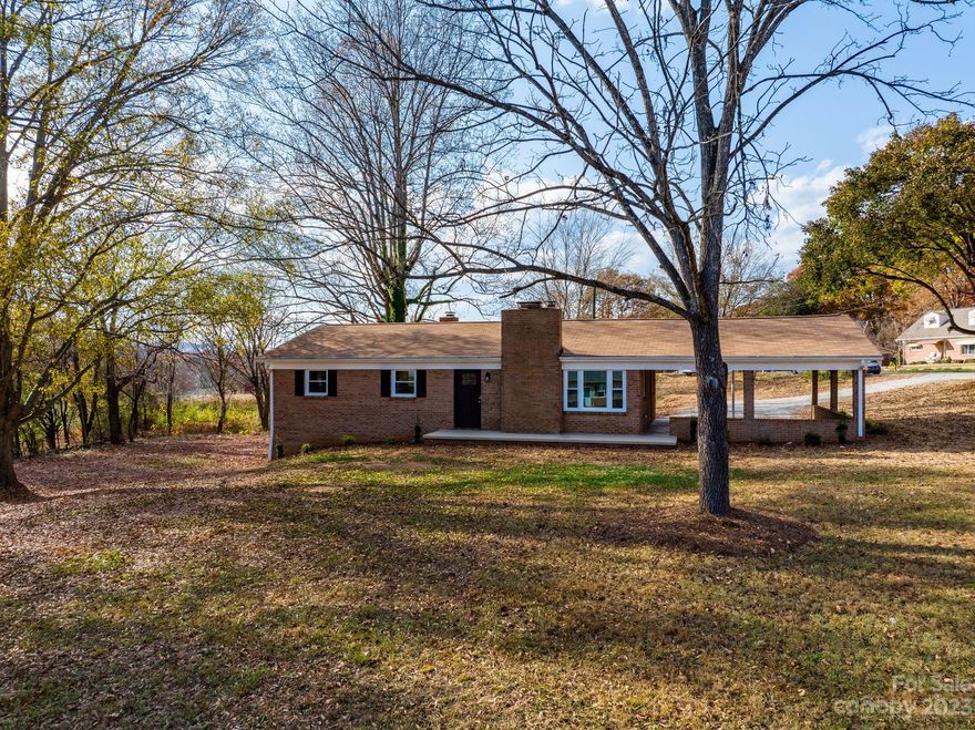 Remodeled Ranch in Connelly Springs located just a few minutes to central Hickory. The main floor welcomes you in with all new LV flooring carried through the charming living room with built-in shelving+fireplace, updated kitchen with a slide-out pantry, built-ins, breakfast area + all new appliances/fixtures, primary bedroom with spacious walk-in closet + full bath, 2 additional bedrooms and a large common area full bath with all new updates+AI mirrors. The redone basement offers a spacious laundry room area, workshop room, garage for storage/lawn mower, and a beautiful family room with a fireplace, outdoor access, and 1 half bath. New roof, water heater, HVAC, flooring, fixtures, paint, chimney caps, garage door..etc! This home is move-in ready with TONS of updates. Schedule your viewing today!