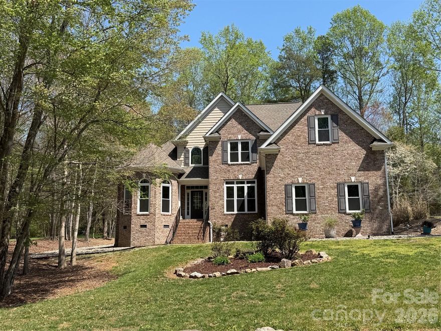 Welcome to 169 Winding Creek Drive in Troutman, a beautifully updated home featuring recent extensive upgrades, including new windows, quartz kitchen countertops, new stainless appliances, and refreshed baths. This versatile home boasts hardwood floors throughout, a main-level primary suite with a jetted tub, a dedicated office, and a bonus room which could be used as additional bedrooms. Enjoy peace of mind with a whole-home Generac generator, tankless water heater, and a low-maintenance deck, all perfectly designed for modern comfort with abundant storage and versatile floorplan.