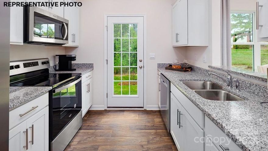 END UNIT TOWNHOME is UNDER CONSTRUCTION-The NEWTON floorplan offers three bedrooms, two & a half bathrooms & a one-car garage. Upon entering the home, you’ll be greeted by an inviting foyer that leads directly into the heart of the home. This impressive space features a living room, dining area, & a well-appointed kitchen. The kitchen is equipped with a LARGE WALK-IN PANTRY, stainless steel appliances, & a pass through from the kitchen to dining area, making it perfect for both cooking and casual dining. The Newton features a luxurious primary suite, complete with a large walk-in closet and en suite bathroom with dual vanities. The additional two bedrooms provide comfort and privacy and share a full bathroom. The large rear patio is perfect for outdoor entertaining or enjoying beautiful weather. Community offers a large outdoor pool, cabana, pickle ball courts, playground and walking trails in sought after location, close to Rock Hill and Fort Mill conveniences. REPRESENTATIVE PHOTOS