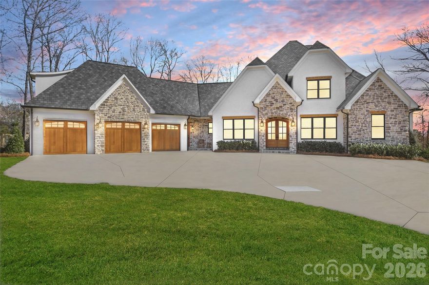 Located in the highly sought-after Pinnacle Ridge community, this exceptional 4-bedroom, 4.5-bath home offers just under 5,000 square feet of thoughtfully designed living space. The open-concept floor plan features site-finished hardwood floors, custom trim and stacked cabinetry, high-end luxury appliances, heated bathroom floors, a stunning stone fireplace with custom pull down mantle mount for TV, and expansive living areas ideal for both entertaining and everyday comfort. The covered back porch is an entertainer’s dream, complete with a built-in outdoor kitchen featuring a 5-burner gas grill and hibachi grill overlooking the huge private backyard w/ plenty of room for a pool! Additional highlights include an oversized driveway, large 3-car garage (large enough for a boat) w/ epoxy flooring, storage closet and custom wood doors, pre-wired home theater (and pre-plumbed for wet bar), amazing attic storage, 50-year designer roof shingles, fully encapsulated crawlspace with dehumidifier and transferable lifetime warranty, whole-house water filtration system, and front and back irrigation systems. Great location just outside Denver with convenient access to Hwy 73, Hwy 16, and Lake Norman.