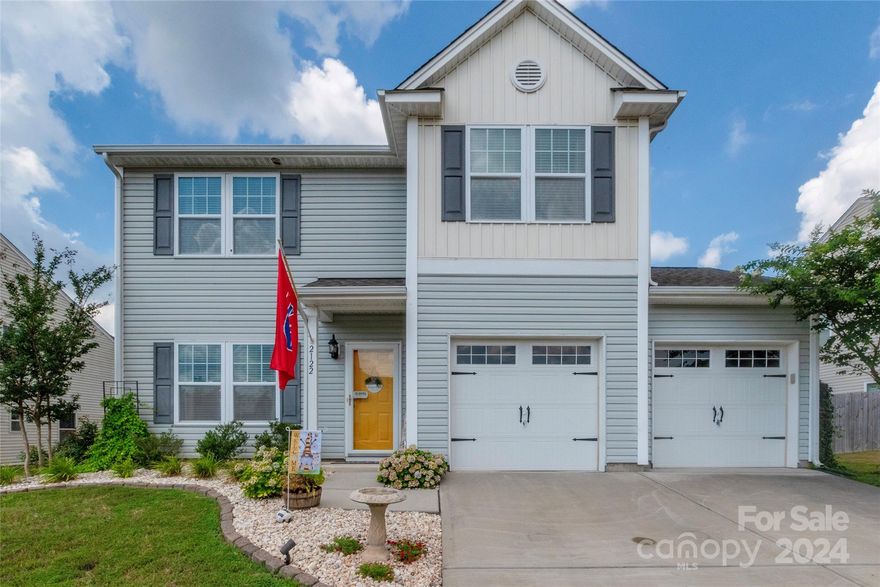 Nestled in a desirable Clover location, this exquisite 3 bedroom, 2.5 bathroom home exemplifies both elegance and comfort. From its captivating curb appeal highlighted by beautiful hydrangeas gracing the front yard to the inviting great room that includes a fireplace with stone surround, every detail of this residence exudes warmth and style. This home features a versatile flex room on the main level, with all bedrooms conveniently located on the upper level alongside a spacious loft area. Step outside to discover a private oasis, complete with a patio adorned with a stone fireplace overlooking an in-ground pool—an ideal setting for both relaxation and entertaining. The covered back patio, features 3 convenient pull-down shades and string lights that convey. Additionally, a shed bolted to a concrete pad and sealed, ensures ample storage space for tools and equipment. UV light has been added to the HVAC. Embrace the opportunity to make this exceptional property your own!