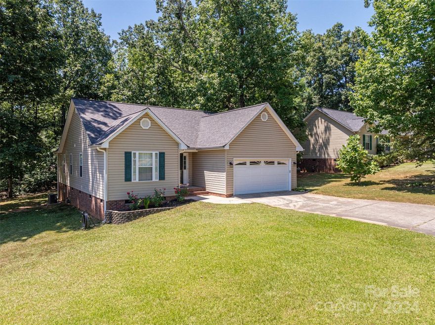 Check out this well maintained Western Gaston County Ranch Home just minutes from I-85 making for an easy commute to the Charlotte Metro Area, Crowder’s Mountain State Park or Two Kings Casino!  This lovely home offers a roomy Den with vaulted ceilings and gas fireplace.  The kitchen/dining space invites you in with the large bay window for natural light and ample cabinet space plus stainless appliances.   The split bedroom plan offers roomy primary suite with dual vanities, garden tub, shower and walk in closet.  The secondary bedrooms are ample size.  The home offers laminate wood, carpet and vinyl flooring.  The 2-car garage offers plenty of parking and storage space.  There is private rear deck offering opportunity to spend time outdoors in the large rear yard.  Move in Ready!