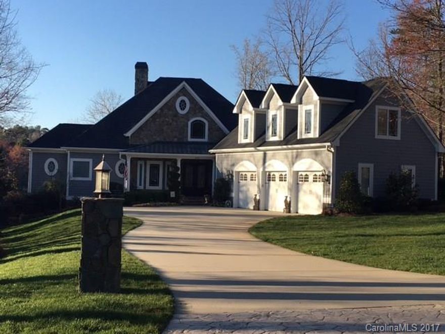 Absolutely gorgeous, custom built waterfront home.  All the bells & whistles you could want.  Wide water views(over 200' on the water) in a quiet, no wake cove.  Master BR on main w/ 3 additional bedrooms on lower level.  Lower level has bar area with media room, exercise room, family room w/fireplace.  Check out the huge, walk in storage area complete with a "safe room."  Elevator.  Oversized 3 car garage.  Screened porch w/ huge deck. Too much to list here-see additional features attached.