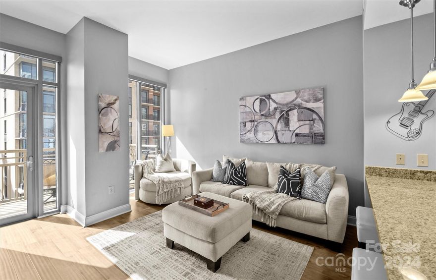 Looking for the perfect place in the heart of Uptown? Look no further because this modern High rise Condo is it!! On the 8th floor, this 1 Bedroom & 1 Full Bathroom Condo with 9 foot ceilings boasts. Open layout with floor to ceiling windows give much natural light to the main living area. Electric blinds on every window that are controlled by a remote (valued at $3,000). Newer Vinyl flooring all throughout the Home with tile in the Bathroom and carpet in the Bedroom. Primary Bedroom has great views from its windows and has a large walk-in closet. Spacious Full Bathroom with dual vanity and tiled wall shower/bathtub. Enjoy some of the best views of the Charlotte skyline and the rest of the city from the outdoor. HOA covers monthly water & sewer bill. Community features of the complex include a Rooftop outdoor pool, cabana, hot tub, fitness center, key fob access to building & elevator, concierge service, and much more! Schedule your showing today!