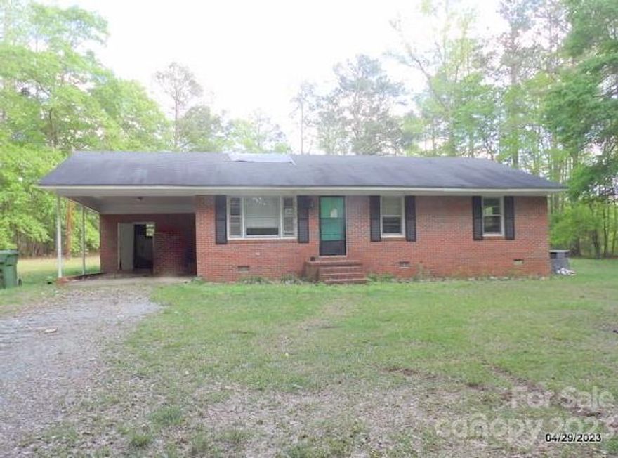 Easy living in this one level full brick home on over three acres of wooded privacy!  Kitchen and dining room combo provide a roomy experience large gatherings.  Hardwood floors are great option for easy upkeep.  Lots of windows throughout for light and fresh air. The large storage building in the back of the lot is perfect for storage or hobbies. Bring your hammer but well worth it.  Make this your new home!