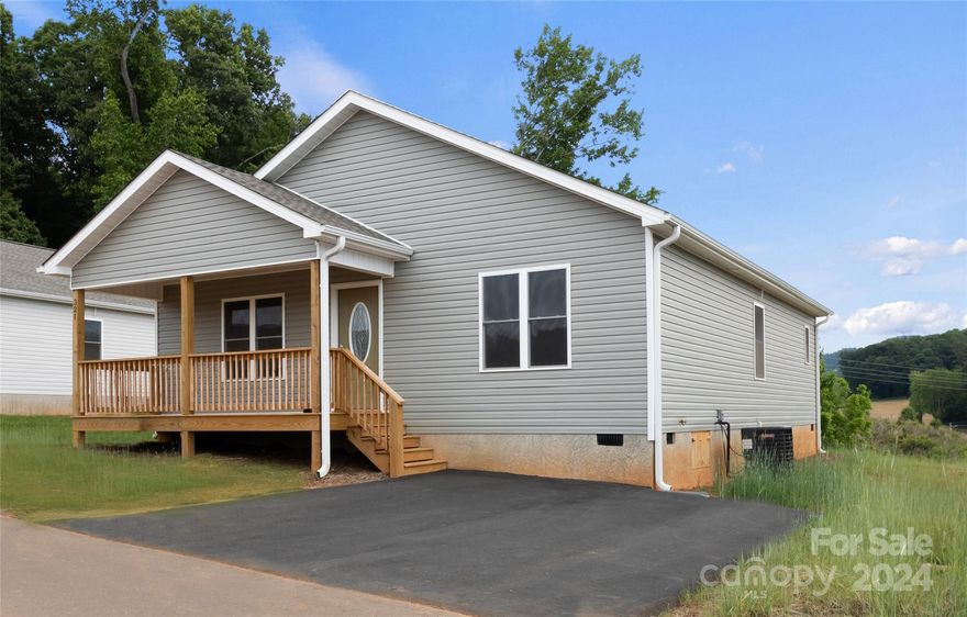 Escape the traffic come be a part of small town life just 20 minutes to downtown Asheville. New construction in  conveniently located new home community in Mars Hill. This site built home offers open floor plan, luxury waterproof vinyl plank flooring throughout, granite counter tops, stainless appliances, 2x6 exterior walls, and a front porch perfect for rocking chairs.  The community offers paved roads, high speed fiber optic internet, green space and all city services, including water/sewer, free trash pickup and free curbside recycling. Close to schools, restaurants and shopping. Homes are USDA and VA approved.  Taxes to be determined. Photos are representative