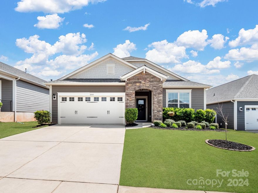 Welcome to this charming 3-bedroom, 2-bath ranch home located in the highly sought-after Walnut Creek community! Enjoy the convenience of maintenance-free living, as landscaping is taken care of by the HOA. The property features a fenced-in backyard, perfect for privacy and outdoor activities, nestled between two cul-de-sacs. As you enter, you are greeted by a wide and inviting foyer. To the right, you'll find two secondary bedrooms and a full bath. To the left, there's a laundry room and a nook with a built-in desk, providing a functional workspace.The open floor plan seamlessly connects the spacious living room, complete with a cozy gas fireplace, to the breakfast nook and chef-style kitchen. The kitchen boasts a large island, gas stove, stainless steel appliances, and a window over the sink. The primary bedroom is located off the living room for added privacy and features a relaxing en suite with his and hers sinks, a tile surround shower, and a walk-in closet.