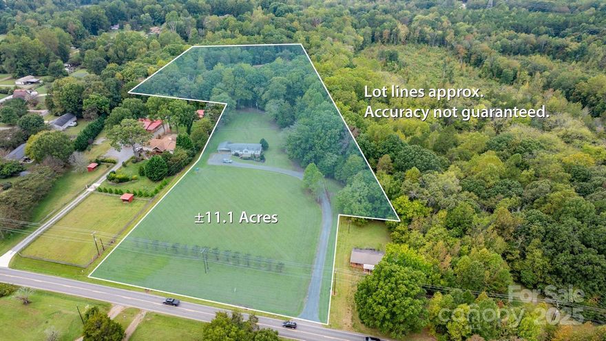 11+ acres with custom shop and home  in a fabulous location on the south side of Mooresville, convenient to Davidson and Concord, but low Iredell Co. taxes and Mooresville school distict. Perfect for buyers looking for a family compound who need a shop, could be divided for multiple homes.  Shop was designed to be used as a fabrication shop, but seller has used it for his honey business the past several years. Not your ordinary shop, fully insulated and climate controlled, with 6" thick epoxy coated interior free-formed 6k psi concrete slab and 6" thick outside slab, 200 amp 1ph service with multiple 50 amp welding outlets, secondary 100 amp sub panel, two 3.5 ton heat pumps w/ electric heat backup, 14' ceiling height inside, two 12' insulated bay doors, steel entry doors, loft area upstairs engineered for heavy weight storage capacity (designed to hold engines), industrial 6" gutters and downspouts, office and full bath w/ shower in shop, 50 gallon WH in shop, two wells on property (one for home, one for shop). Doublewide is 3 BR/2BA with new flooring and fresh paint, double carport, large back yard.  Live in DW while you build your dream home or homes in this terrific location.