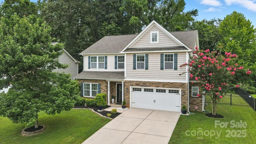 Welcome to this 4-bed, 2.5-bath home in a newer construction but established neighborhood with direct access to Little Sugar Creek Greenway, minutes from Carolina Place, Ballantyne Bowl, and Kingsley Town Center with convenient access to I-77 and the I-485 beltway. Located on a peaceful cul-de-sac, this home features screened porch access to a fenced yard providing tranquil views into a wooded area along the creek, with a stunning outdoor kitchen and new deck. Inside boasts an open layout with tons of natural light, featuring a kitchen having ample cabinetry and a grand island with cozy eat-in area, with formal dining flowing into the living area, drop zone entry off an enlarged garage, and a private main-level office with elegant French doors. Upstairs you’ll find a bonus room/second office space just off the laundry area - perfect for remote work, hobbies, or a playroom. Blending comfort, functionality, and location, this home is priced to sell, with seller-paid 1 year home warranty.