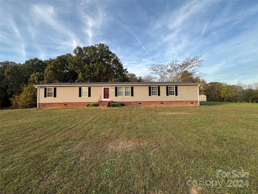 REDUCED! This terrific opportunity awaits someone in need of a larger home which is priced to sell. Well maintained manufactured home in quiet neighborhood.  This four-bedroom, three full bath home rests on approximately .91 acres +/-.  This gem is waiting for you to make it your own. This large doublewide boasts new HVAC, installed in July 2024, over 2000 SF of HLA. All appliances convey.  Refrigerator is one year old, washer and dryer are approximately four years old. Roof was installed in 2016. The seller described the stunning sunsets as being his favorite attribute to the location. County water is available through Pfeiffer-North Stanly Water Association. Property  is offered as is / where is. Seller will not be making additional repairs or renovations.