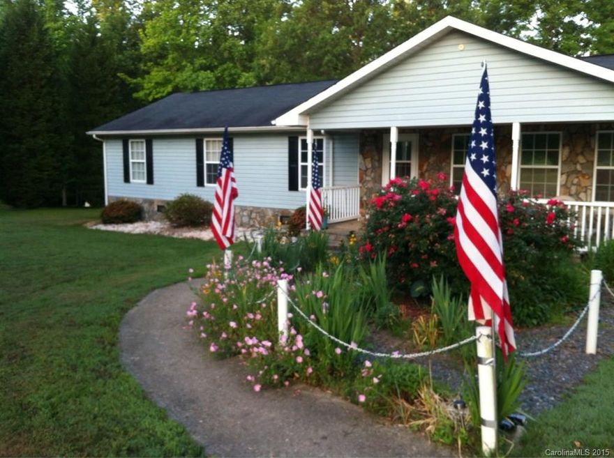 Has many extras including partial stone front,  hard wood flooring and a wired workshop in detached 24x34 Garage.  Screened in Sunroom in back yard.  3 bedrooms plus a bonus room with closet.  It has a beautiful deck in the back and over an acre of land to spread out.  Includes washer, dryer, refrigerator, range/oven, and built in Microwave!