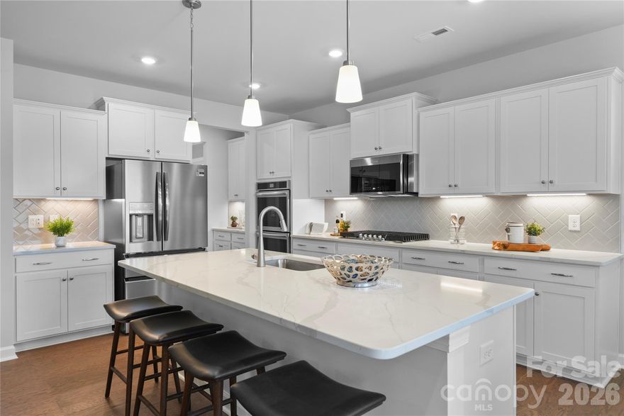 Final opportunity in Phase 1 of Harris Mill, this spacious home features a large open floorplan designed for modern living on a private homesite with no neighbors behind. Highlights include a gourmet kitchen, a cozy fireplace with built-in cabinets, and a primary suite conveniently located on the main floor, along with a guest bedroom. Upstairs, you’ll find three additional bedrooms, a generous bonus room, and a versatile loft space. Enjoy relaxing on the welcoming front porch or the screened back patio. Ideally situated near Ballantyne and Waxhaw, this home also offers easy access to the new Costco and Target in Indian Land. This home just started construction and has a target of an August completion.  Currently we are working on the foundation.