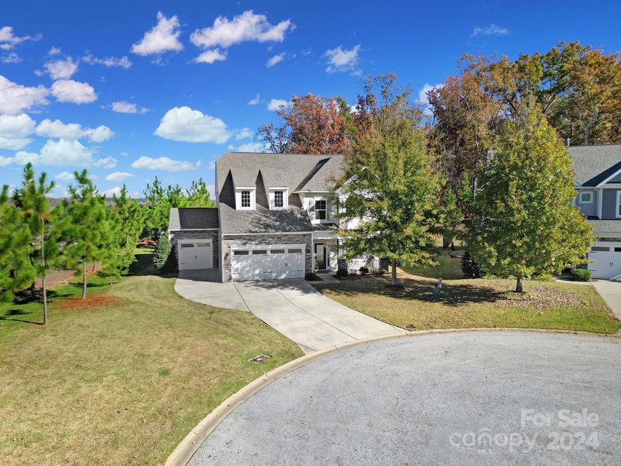 This is a "must see" 5 bed/4 bath, 2900+ sqft , cul-de-sac home that backs up to woods. Sealed flooring in 3-car garage. This is one the largest lots in Walnut Creek! Chef Kitchen w/double wall ovens, granite countertops. Open floor plan with 9 foot ceilings down, beautiful upgraded vinyl plank floors throughout first floor, rich crown and box molding, large family room w/fireplace, formal dining room, guest suite on main w/it’s own full bath. Second floor boasts spacious master suite with master bath w/huge walk in closet, soaking tub, separate shower, double vanities with sinks.You will also find a loft and two additional large bedrooms and the laundry room.The third floor can be used as a 5th bedroom or your getaway, great for a rec room, movie room, or play area. Full bath on the top floor. Huge private backyard with large patio, play set, and fire pit. NEST thermostats w/ 3-zone air. Amenity rich community features pool, playground, walking trails, fitness center. Low SC taxes!