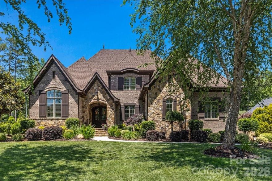 Pristine brick and stone 5 bedroom 5 1/2 bath home in beautiful Skyecroft. Upgraded and arched moldings, 5-inch walnut wood floors, coffered, tray, barrel and vaulted ceilings, and built-in cabinetry are just a few of the many custom features. 1st floor primary suite with oversized closet and en-suite guest bedroom and office. Upstairs features two en-suite oversized bedrooms and one Jack and Jill bedroom with bonus room. Two storage areas of 500 sq. ft. are ready to finish complete with dry wall and electrical runs. Energy efficient with sealed-conditioned crawl, 2 tankless water heaters, dual fuel heat pump on 1st floor, two stage high efficiency AC units, gas-start wood fireplace and Icynene foam insulation. Central vacuum with kick plates, chandelier lift, the amenities are endless. Outside is perfect for entertaining on the huge covered porch with heated saltwater pool w/tanning ledge and spa, grill, refrigerator, ice-maker, sink, and smoker. Nine-zone irrigation system throughout landscaping and vegetable garden. Ample low-voltage lighting, wired for generator and CCTV security system. Come and see this one-of-a-kind beauty!