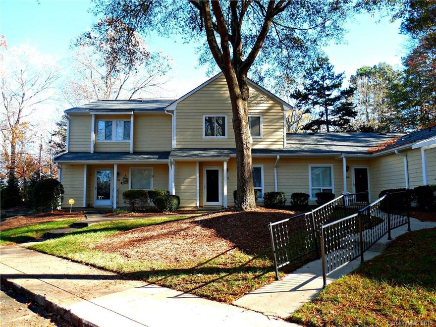 A park-like setting surrounds this lovely townhome - enjoy meticulous landscaping from the private back patio. Newer wood laminate floors gleam in the open living & dining rooms. Kitchen opens to breakfast area, and fridge stays! Two masters upstairs & larger has walk-in closet. HOA covers cable, water, sewer & trash pickup. Seller will pay $2,160 assessment for new roof at closing. Move in ready or update for equity! Quiet community convenient to 74 and Matthews. Access to McAlpine Greenway!